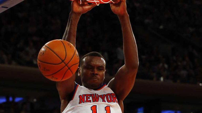 Samuel Dalembert #11 of the New York Knicks dunks the ball in the first half of a game against the Cleveland Cavaliers at Madison Square Garden on Thursday, Dec. 4, 2014.