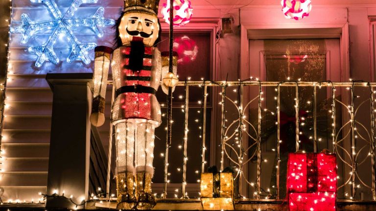 A nutcracker surveys the scene from the second story of a house on Bay Ridge Parkway in Brooklyn's Dyker Heights.