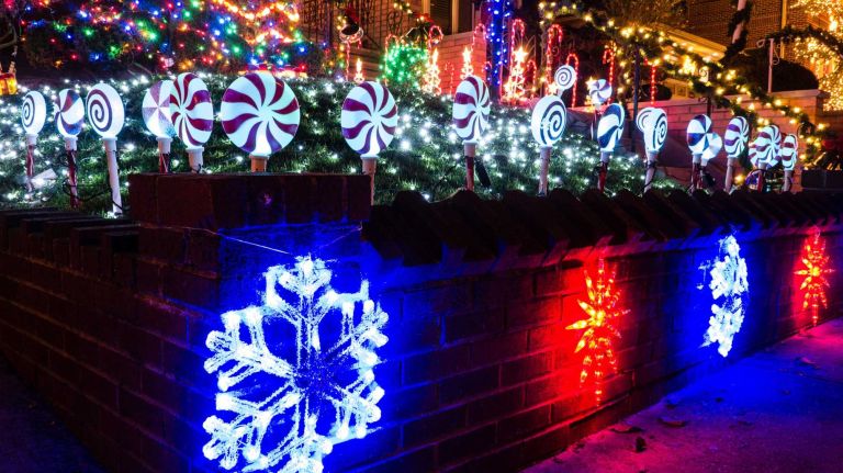 Candy cane lights and illuminated snowflakes make up part of a display on Twelfth Avenue in Dyker Heights, Brooklyn.