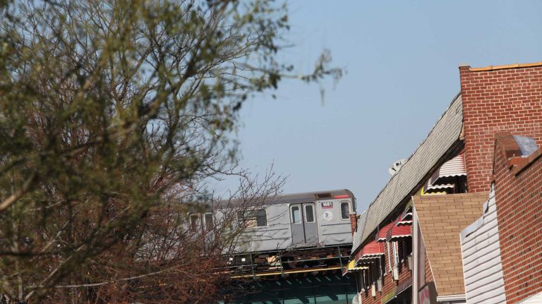 The 6 train passing by houses along Rosedale ave. in the Soundview section of the Bronx, Thursday, Nov., 20, 2014.