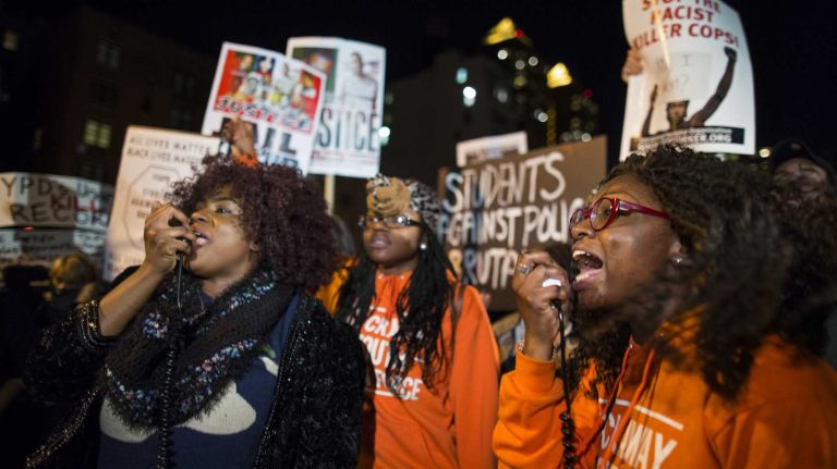 People gather at Union Square in Manhattan on Monday, Nov. 24, 2014, as they await word of the grand jury's decision on whether to recommend charges against Ferguson police Officer Darren Wilson. Wilson shot and killed an unarmed Michael Brown in August, sparking violent protests in Ferguson, Mo.
