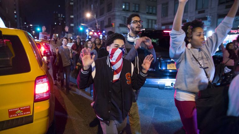 Protesters react in Manhattan Monday, Nov. 24, 2014, after a grand jury decision declined to indict Ferguson, Mo., police Officer Darren Wilson in the death of Michael Brown in August.