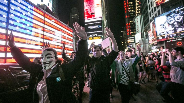 Protesters react in Times Square, Monday, Nov. 24, 2014, after a grand jury decision declined to indict Ferguson, Mo., police Officer Darren Wilson who shot and killed an unarmed Michael Brown in August.