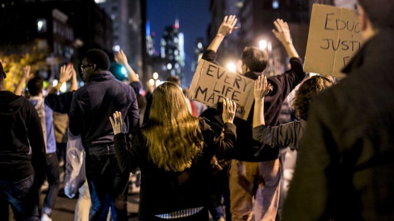 In Union Square, protesters respond to the news on Monday, Nov. 24, 2014, that a grand jury declined to indict Ferguson, Mo., police Officer Darren Wilson who shot and killed an unarmed Michael Brown in August.