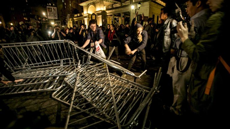 Protesters react in Union Square, Monday, Nov. 24, 2014, after a grand jury decision declined to indict Ferguson, Mo., police Officer Darren Wilson who shot and killed an unarmed Michael Brown in August.