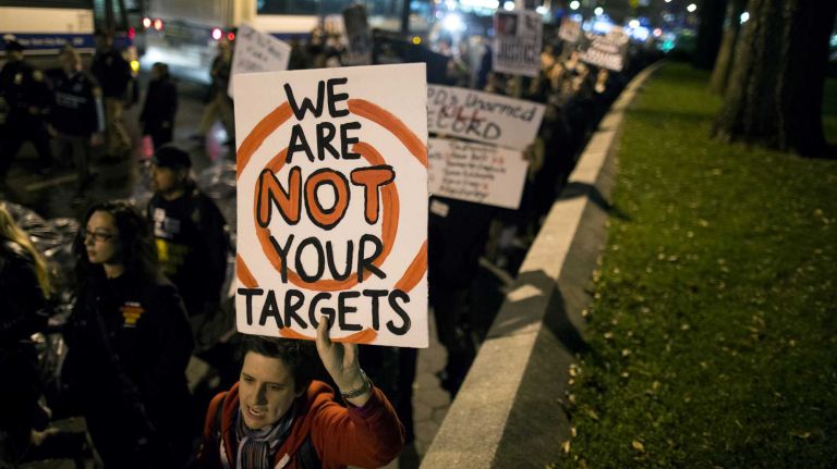 People gather at Union Square in Manhattan Monday, Nov. 24, 2014, as they await for word if a grand jury will recommend charges against Ferguson officer Darren Wilson who shot and killed an unarmed Michael Brown in August, sparking violent protests in Ferguson, Mo.