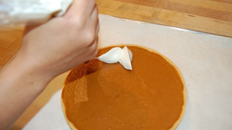 Bouchon Bakery's Simple Thanksgiving Pumpkin Pie recipe 31 <p>Remove tart mold.</p> <p>Make whipped cream by beating heavy cream with sugar and vanilla bean to taste. Bouchon Bakery uses a pastry bag to paint leaves on the pie, but you can decorate as you wish. Top with scatted roasted pumpkin seeds.</p>