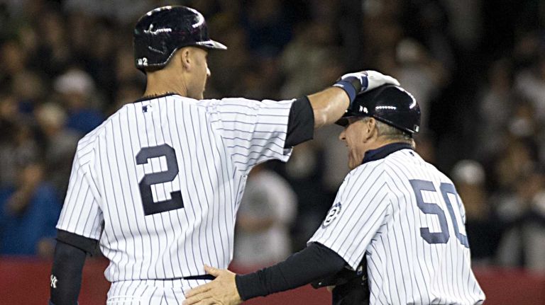 Derek Jeter's final game at Yankee Stadium 148 Yankees' Derek Jeter gets a pat on on the rear by first base coach Mick Kelleher at second base after hitting an RBI double in the first inning against the Baltimore Orioles at Yankee Stadium on Thursday, Sept. 25, 2014.