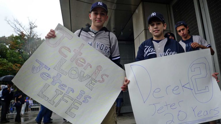 Derek Jeter's final game at Yankee Stadium 182 Nick Breton, 13, and Daniel Breton, 11, of Ballston Lake, N.Y. hold Derek Jeter signs before Jeter's final game at Yankee Stadium on Sept. 25, 2014.