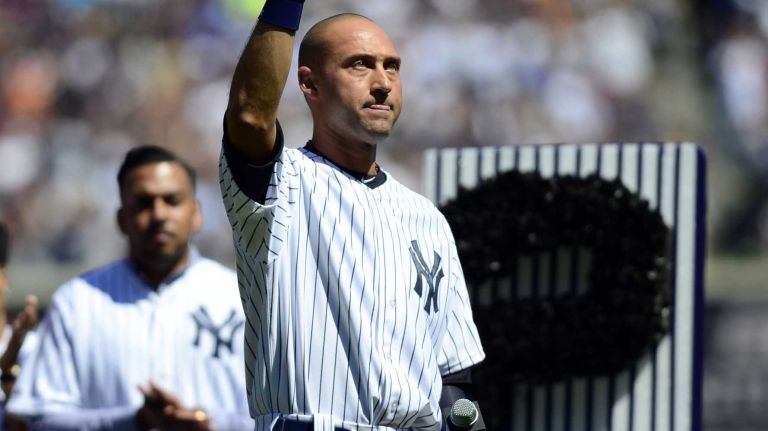Yankees shortstop Derek Jeter waves to the crowd at Yankee Stadium during Derek Jeter Day on Sunday, Sept. 7, 2014