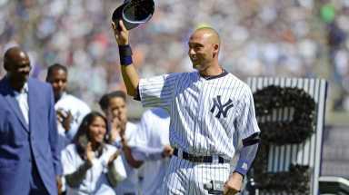 Yankees shortstop Derek Jeter waves to the crowd at Yankee Stadium during Derek Jeter Day on Sunday, Sept. 7, 2014