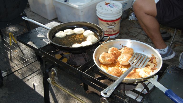 Biscuits were frying at the Caribbean Delights stand on Eastern Parkway and Nostrand Avenue. 