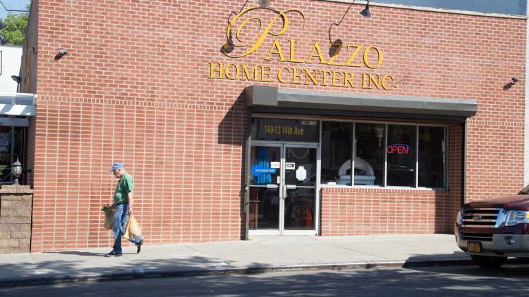 A pedestrian walks by Palazzo Home Center in Whitestone on August 27, 2014. 