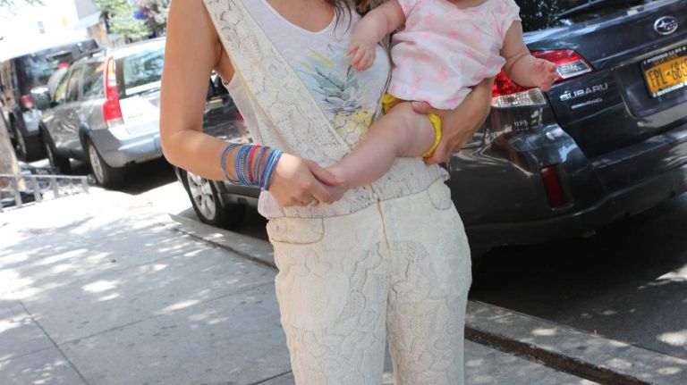 Carina Rogard, 34, an architect from Paris, with daughter, Jade, 8 months, wore a lace jumper by French designer Alix Petit on Elizabeth street on July 25, 2014. 
