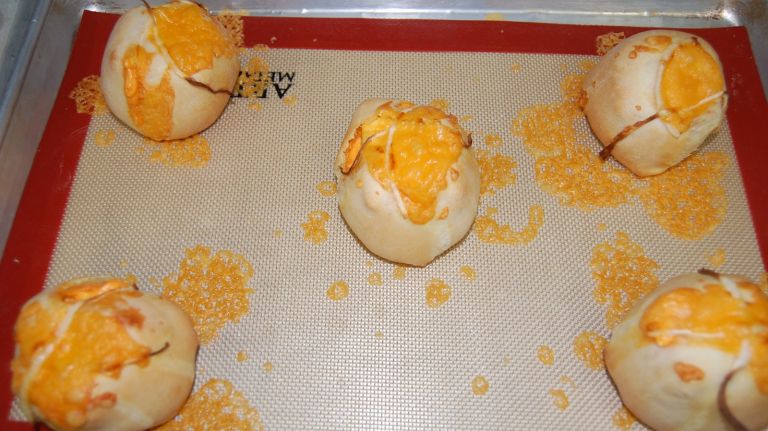 Egg & Cheddar Bombs, just out of the oven. Milk Bar tests baking times and ingredient ratios obsessively. All bread and bakes items are prepared and cooked at the Williamsburg bakery, and then delivered to the four other NYC locations. 