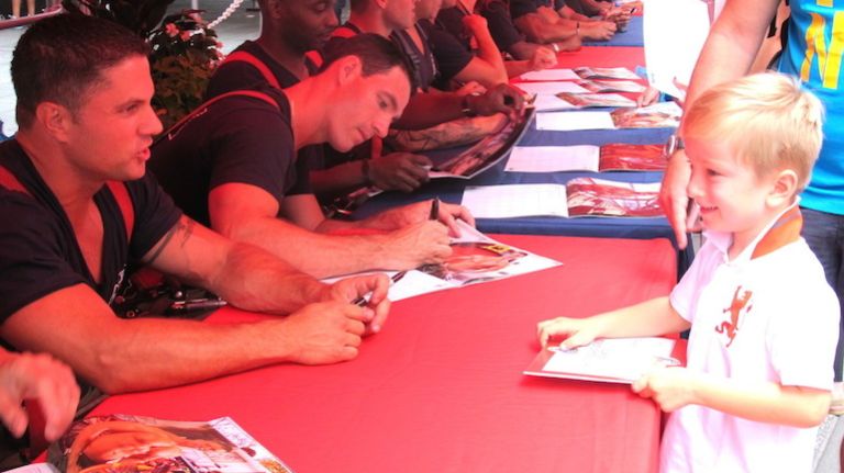 A young prospect meets his FDNY heroes in Times Square on July 15, 2014.