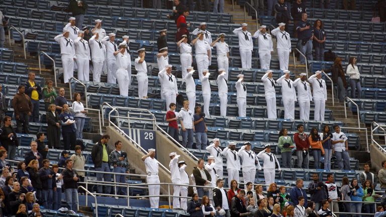 Sailors in the upper deck stand for the national anthem at the start of Fleet Week during the game between Baltimore and the Yankees at Yankee Stadium on May 21, 2008.