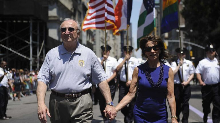 NYPD Commissioner William Bratton and his wife Rikki Klieman march during the New York City pride parade in Manhattan on Sunday, June 29, 2014.