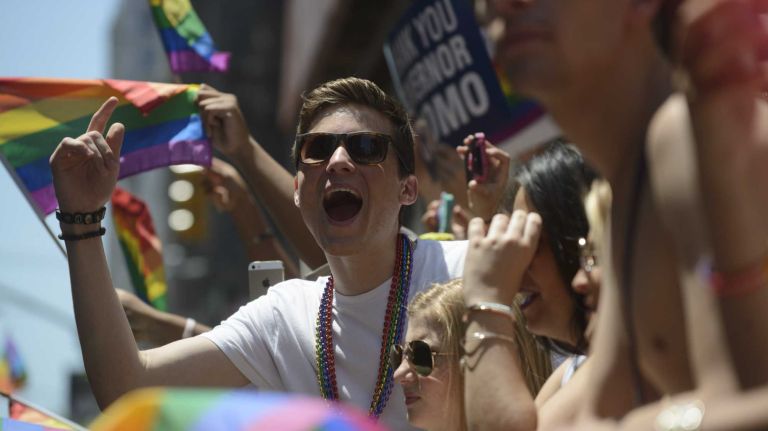 Spectators participate in the New York City Pride Parade in Manhattan on Sunday, June 29, 2014.