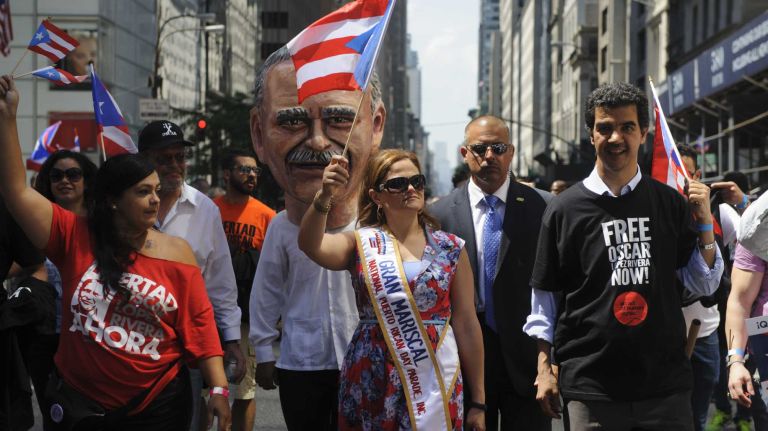 City Council Speaker Melissa Mark-Viverito, center, marches in the 57th annual National Puerto Rican Day Parade in Manhattan on Sunday, June 8, 2014.