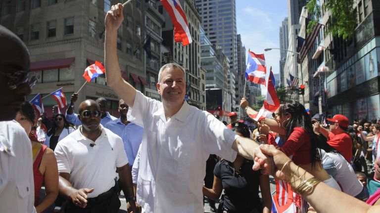 New York Mayor Bill de Blasio marches in the 57th annual National Puerto Rican Day Parade in Manhattan on Sunday, June 8, 2014.