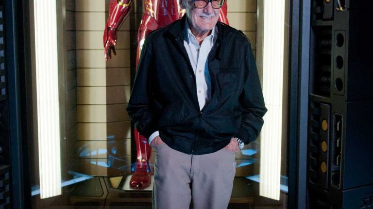 Marvel's Avengers S.T.A.T.I.O.N. exhibit 13 Comic book writer Stan Lee stands before a model of his creation Iron Man at the exhibit of