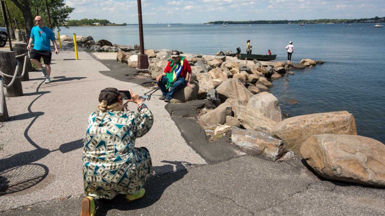 A photographer takes snapshots along Little Neck Bay in North Bayside. 