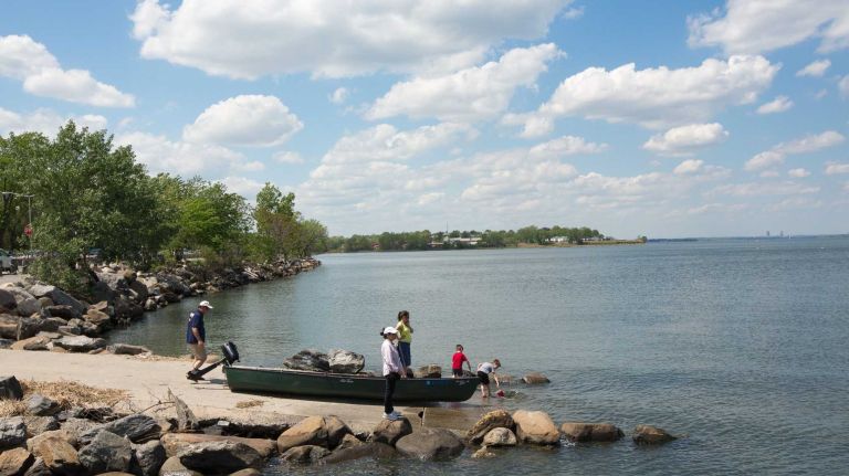 A family prepares to launch a boat into Little Neck Bay in North Bayside on Saturday, May 17, 2014. 