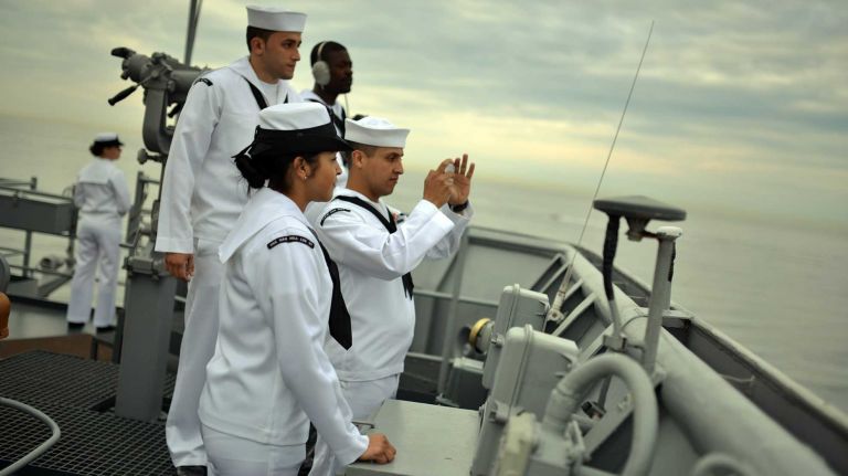 Sailors aboard the USS Oak Hill during the Parade of Sails as their vessel moves on the Hudson River during the first day of Fleet Week on May 21, 2014.