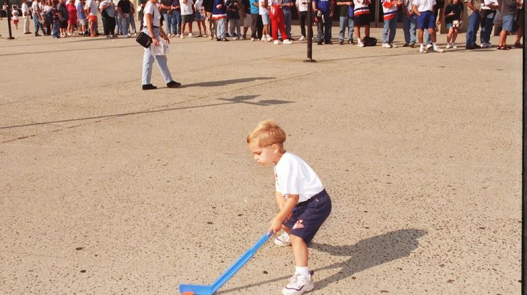 Classic street games: Stickball, handball and more 10 Nicholas Mortemagno, 3, of Lindenhurst, Long Island, plays street hockey outside Nassau Coliseum in 1997.