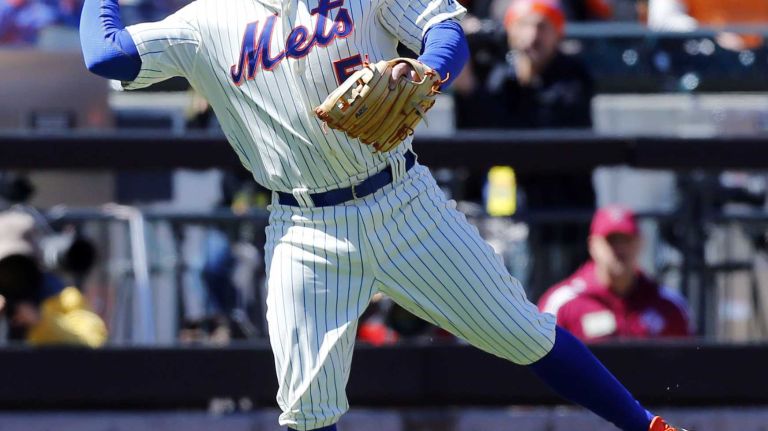 David Wright throws to first for an out in the first inning of a game against the Washington Nationals at Citi Field on Monday, March 31, 2014.