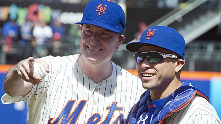 New York City mayor Bill deBlasio and New York Mets catcher Travis d'Arnaud acknowledge the fans after throwing out the first pitch at Citi Field on Opening Day on March 31, 2014. 