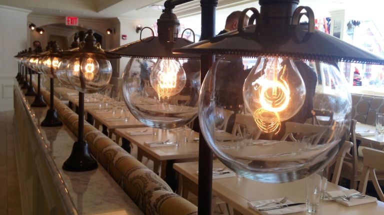 You won't find any flashy lighting at the new Tavern on the Green, and that's not to save money on electric bills. The idea is to evoke the ambiance of 1934, when electricity was less advanced. The globes on each light, made to look like vintage gas lamps, were all created by American glassblowers. The same globes are used on the ceiling fixtures, along with glass sourced from antique windows. 