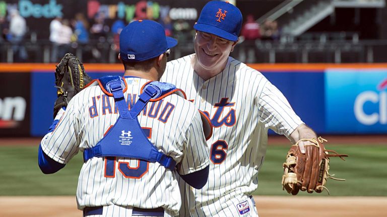 New York City mayor Bill deBlasio greets New York Mets catcher Travis d'Arnaud after throwing out the first pitch at Citi Field on Opening Day on March 31, 2014. 
