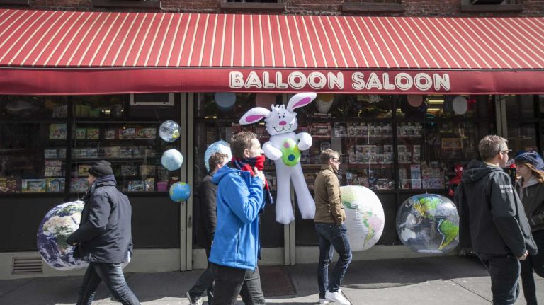 People walk by the Balloon Saloon in TriBeCa on March 20, 2014.