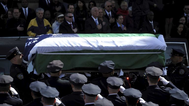 NYPD Officer Dennis Guerra remembered at memorial, funeral 26 The coffin holding the body of fallen NYPD Officer Dennis Guerra is carried into St. Rose of Lima Roman Catholic Church on Monday, April 14, 2014. Guerra, 38, died early Wednesday, April 9, of smoke inhalation and carbon monoxide poisoning after he and fellow officer Rosa Rodriguez were overcome by dense smoke and toxic fumes in a Coney Island high-rise fire on April 6.