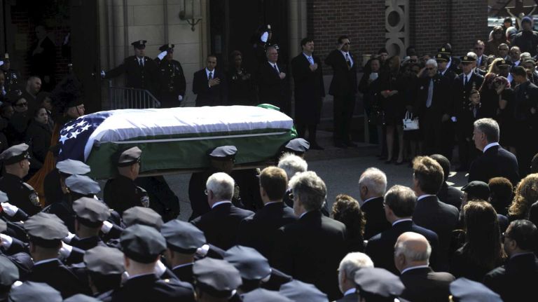 NYPD Officer Dennis Guerra remembered at memorial, funeral 30 The coffin holding the body of fallen NYPD Officer Dennis Guerra is carried into St. Rose of Lima Roman Catholic Church on Monday, April 14, 2014. Guerra, 38, died early Wednesday of smoke inhalation and carbon monoxide poisoning after he and fellow officer Rosa Rodriguez were overcome by dense smoke and toxic fumes in a Coney Island high-rise fire on April 6.