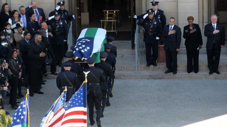 NYPD Officer Dennis Guerra remembered at memorial, funeral 36 Police salute as the coffin of NYPD Officer Dennis Guerra arrives for his funeral Mass at St. Rose of Lima Church in Far Rockaway on April 14, 2014.