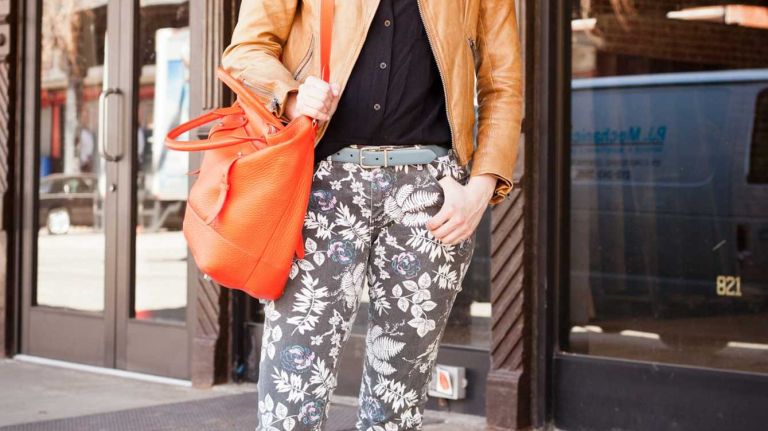 Glassbook magazine creative director Jessica Lewis, of Bed-Stuy, gets spring-ready in floral-print Levi’s jeans, worn with a Korintage leather jacket, Mackage handbag and shoes she bought in the South of France.
