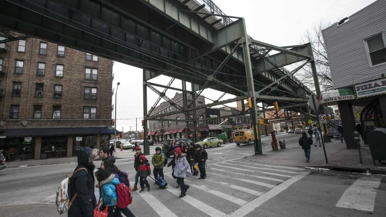 Woodside 11 Pedestrians cross a street in Woodside's business district on March 4, 2014.