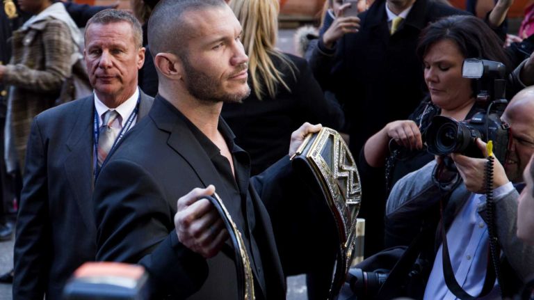 WWE star Randy Orton shows off his belt as he arrives at the Hard Rock Cafe in Manhattan on April 1, 2014, as they kick off WrestleMania 30 week.