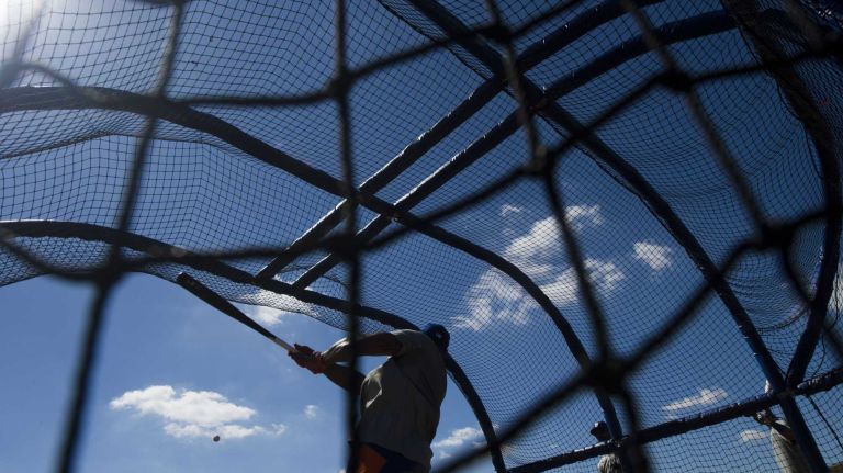 New York Mets' Eric Young takes batting practice during spring training on Feb. 18, 2014, in Port St. Lucie, Fla.