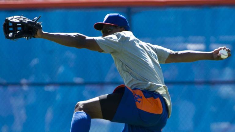 Curtis Granderson gets ready to throw during spring training Monday Feb. 17, 2014 at Tradition Field in Port St. Lucie, Fla.