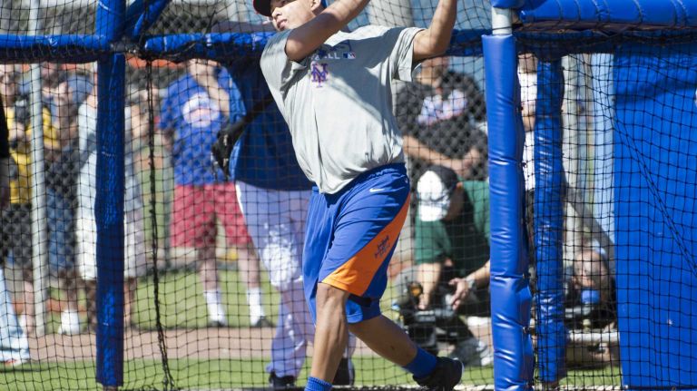 Ruben Tejada takes batting practice during spring training Monday Feb. 17, 2014 at Tradition Field in Port St. Lucie, Fla.