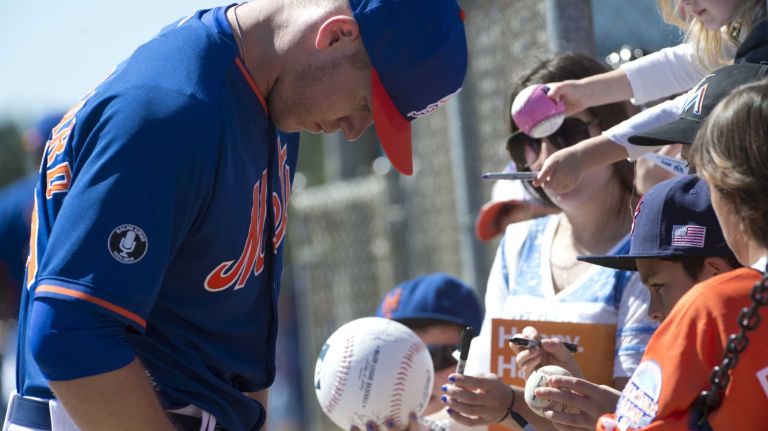 Noah Syndergaard signs autographs during spring training Monday Feb. 17, 2014 at Tradition Field in Port St. Lucie, Fla,