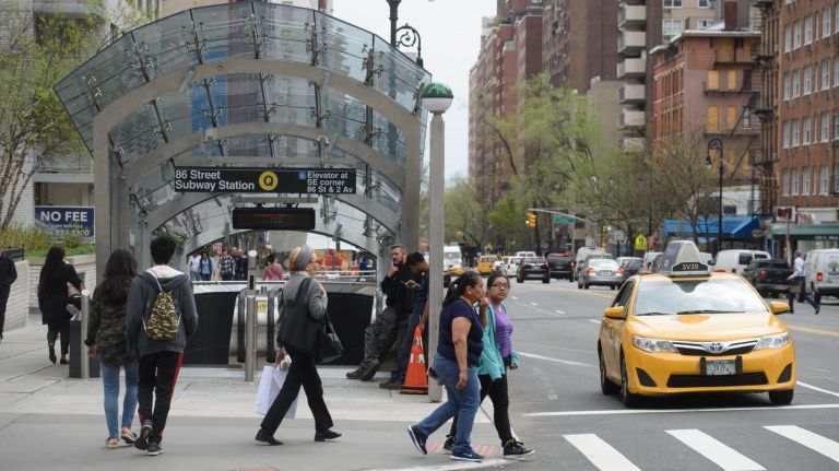Yellow taxis are seeing a drop in hails near Second Avenue subway stops in Manhattan, a new report shows. Above, a yellow cab  travels  along East 86th Street near  Second Avenue  in Manhattan, Monday, April 17, 2017.