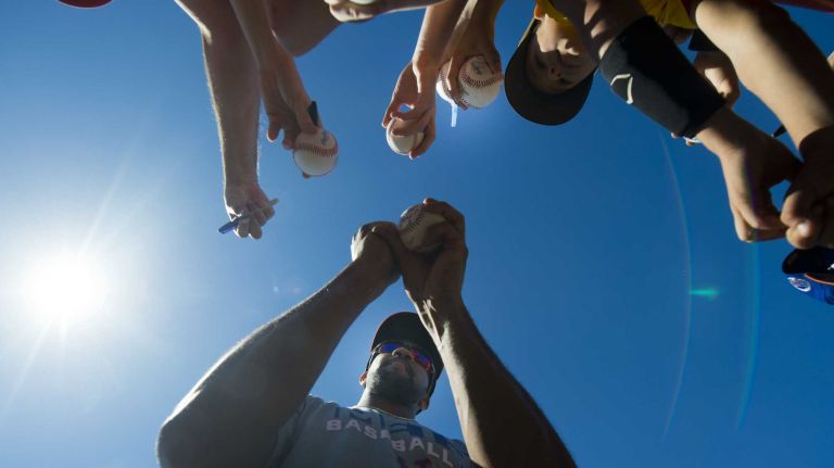 Chris Young signs autographs during spring training Monday Feb. 17, 2014 at Tradition Field in Port St. Lucie, Fla.