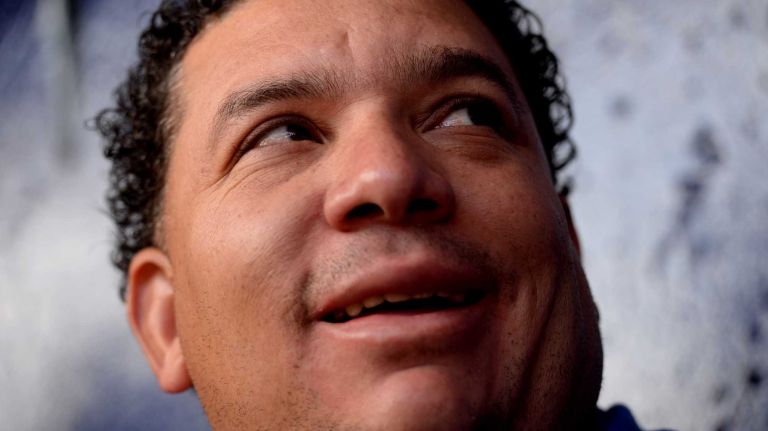 Mets pitcher Bartolo Colon talks to reporters after arriving at Tradition Field on Saturday, Feb. 15, 2014.
