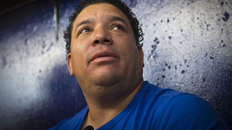 Mets pitcher Bartolo Colon talks to reporters after arriving at Tradition Field on Saturday, Feb. 15, 2014.