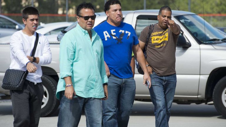 Mets pitcher Bartolo Colon, second from right, arrives with others at Tradition Field on Saturday, Feb. 15, 2014.